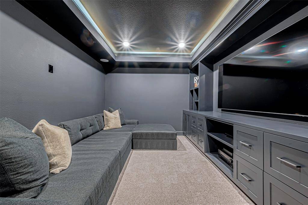 Step into the dedicated home theater, a true cinematic experience right at home. The room is designed with comfort in mind.