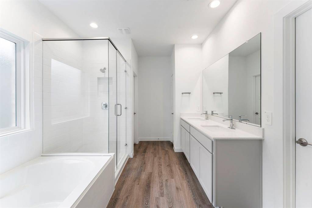 The door on the right side of the photo is the walk-in closet. The door on the left side of the photo, after the walk-in shower is the water closet. Across is the linens closet.