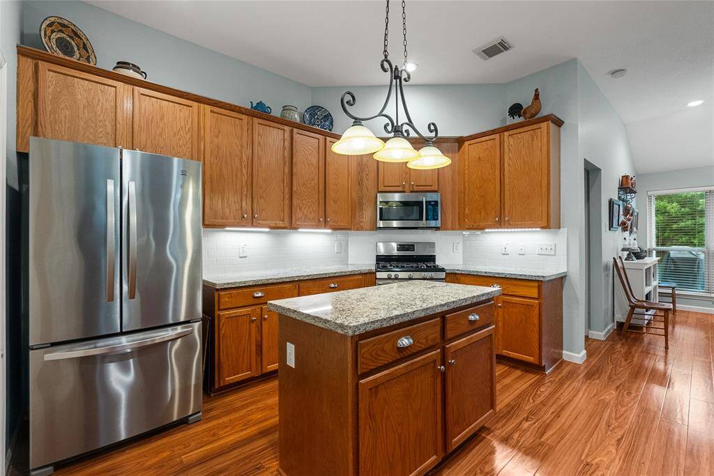 Updated Kitchen with Granite and Stainless Steel Appliances and Updated Backsplash