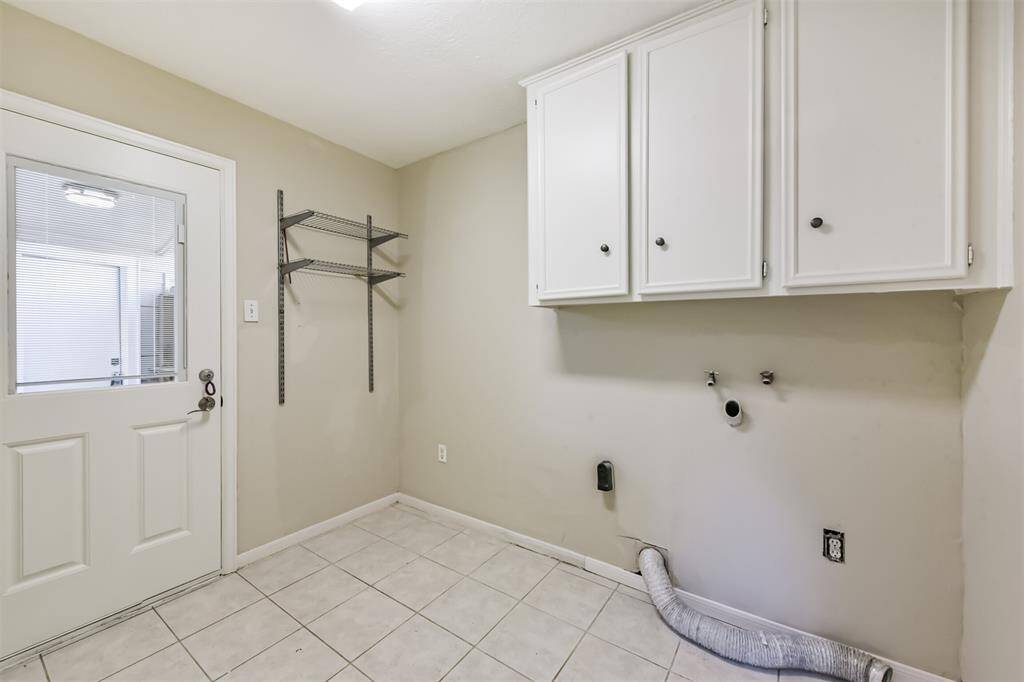 The utility room accommodates a full size washer and dryer.