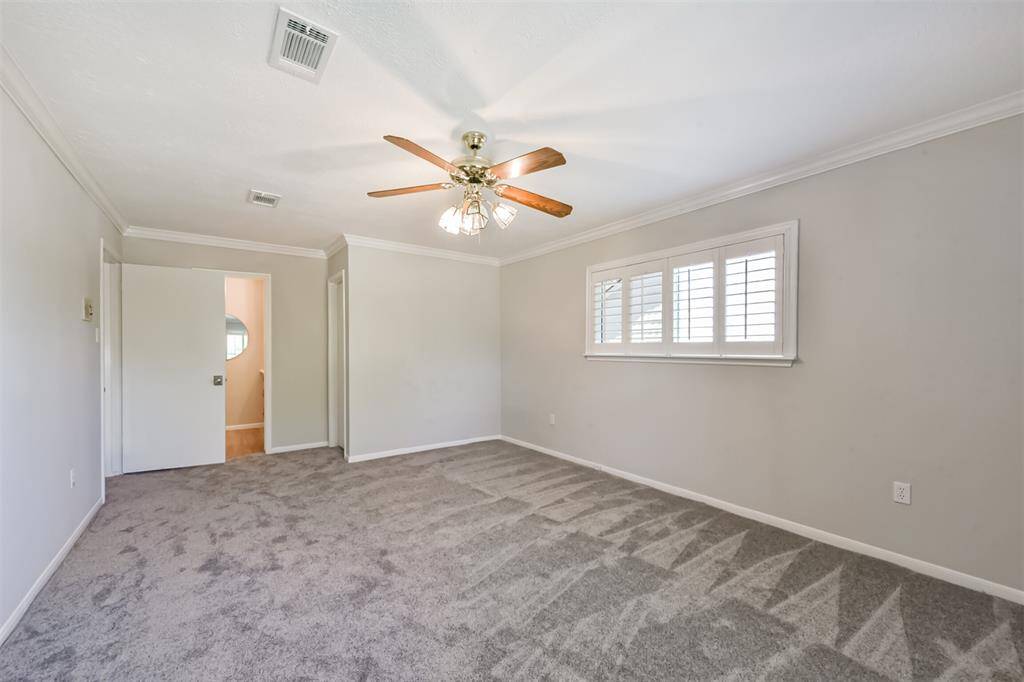Another view of the primary bedroom.