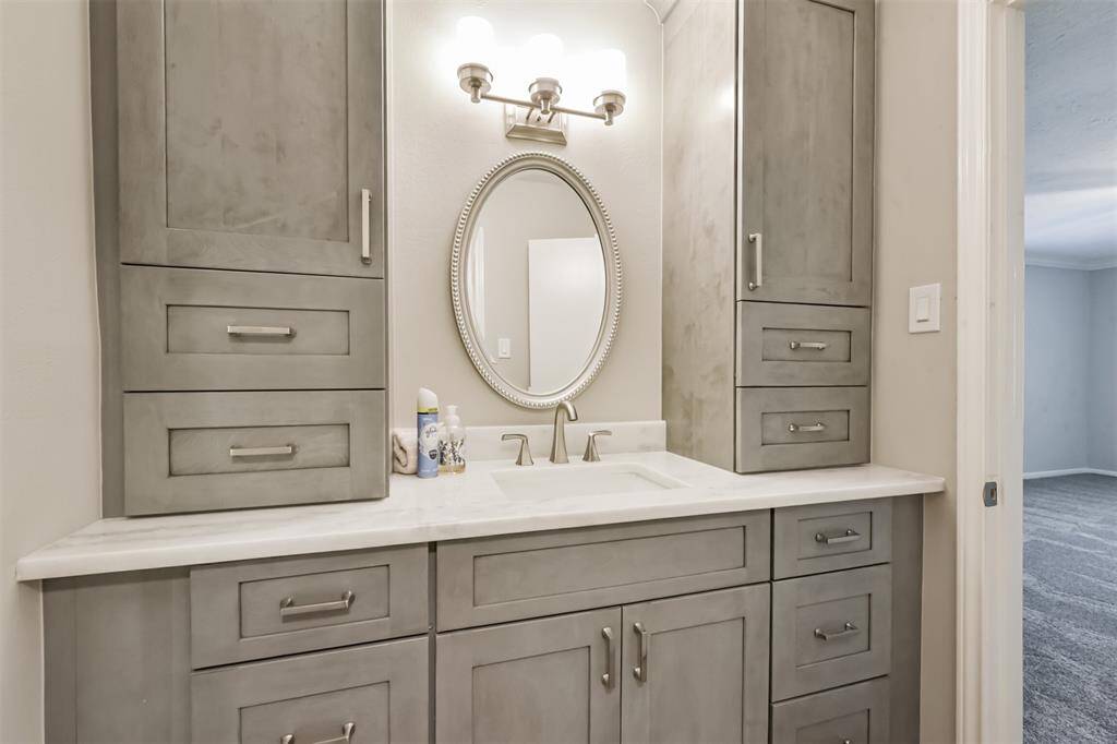The vanity in the primary bathroom has been updated.