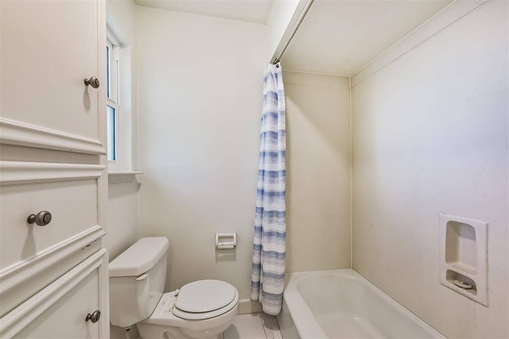 There is a tub+shower duo in the second full bathroom.