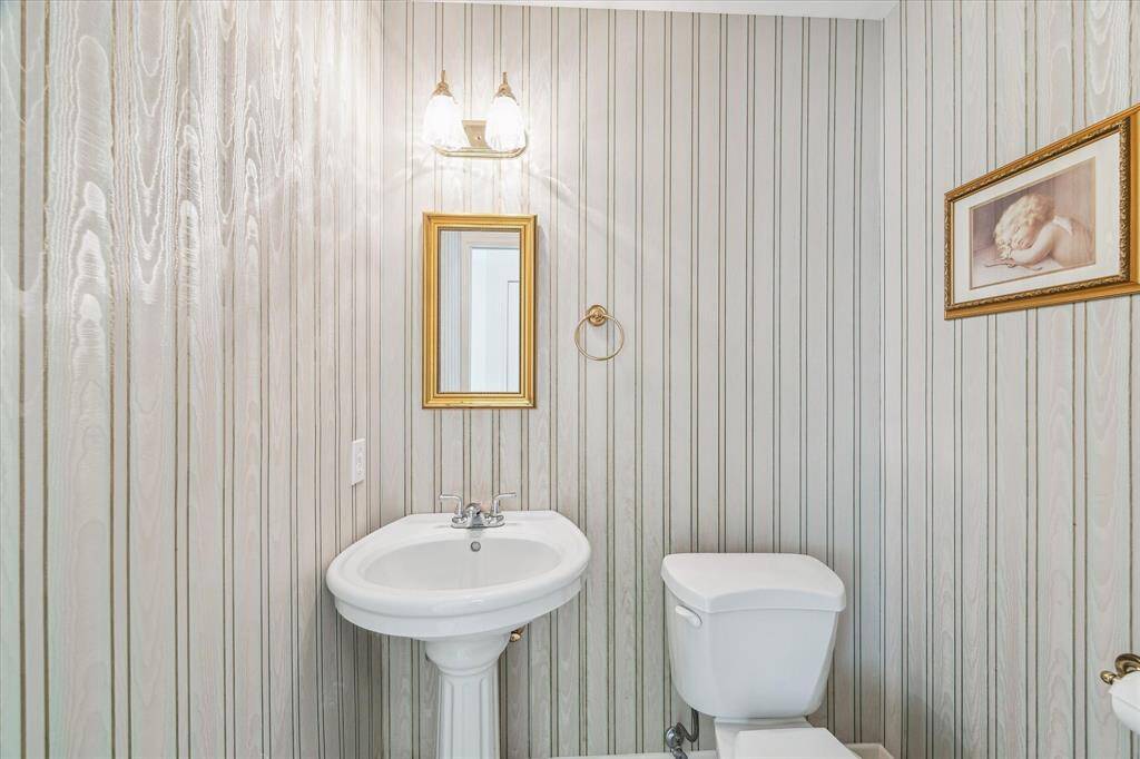 Half Bathroom is located within the huge Utility Room space.
