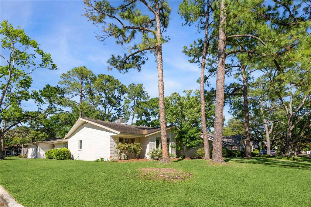 With 4 bedrooms and 2 1/2 bathrooms, home sits on an oversized corner lot.