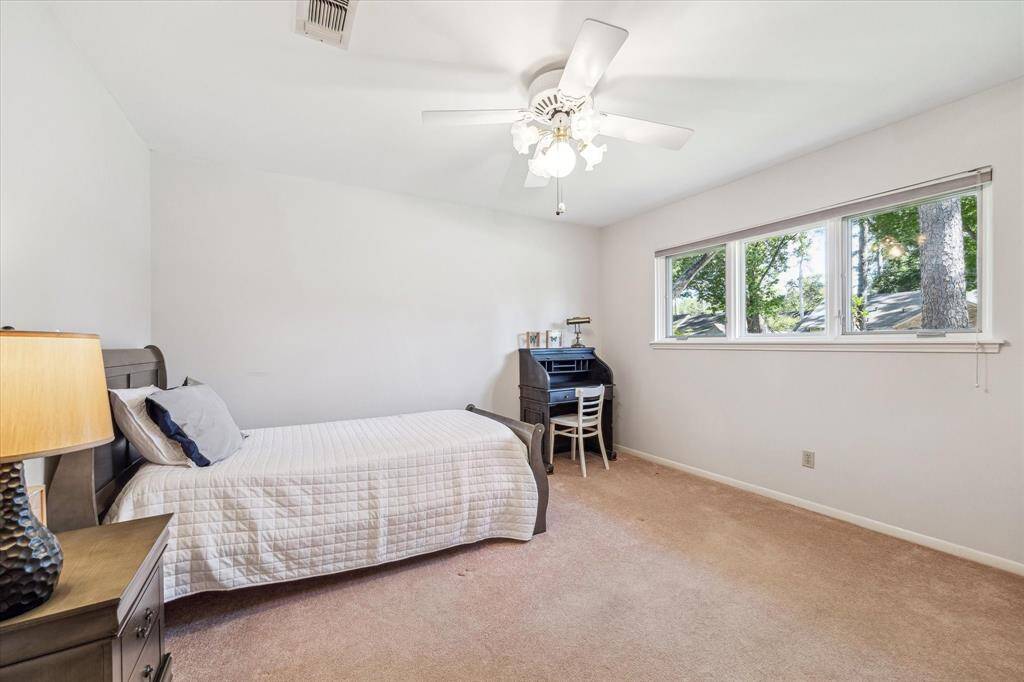 Secondary Bedroom has ceiling fan and large closet.
