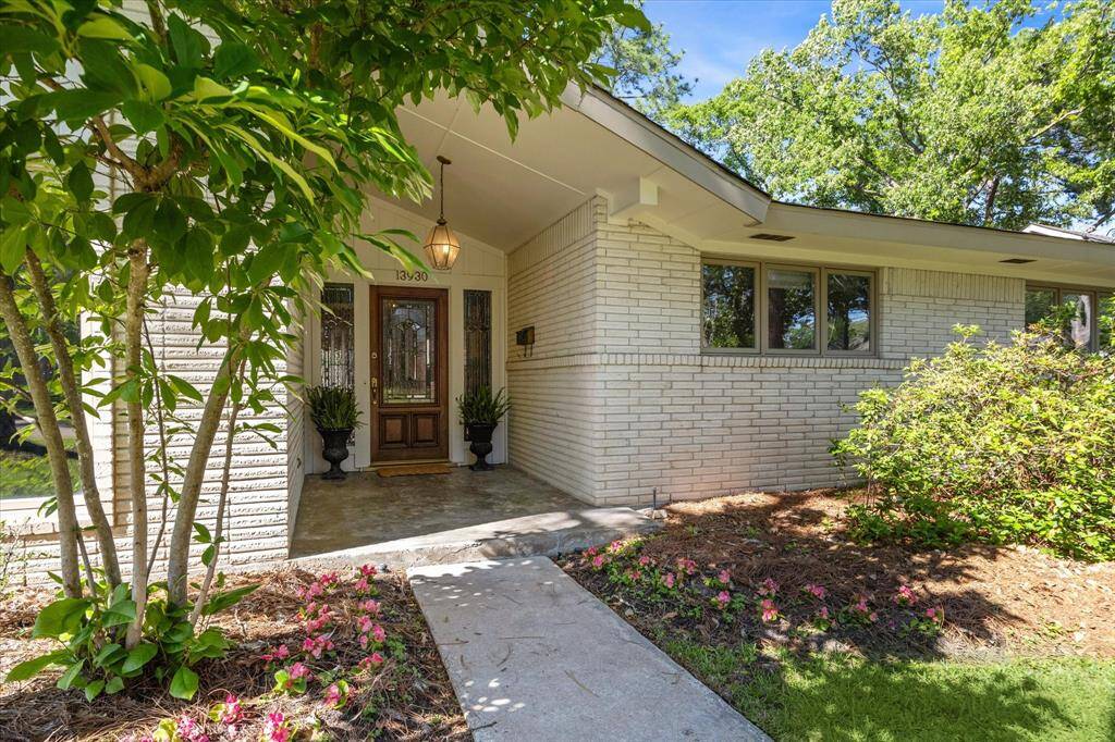 Covered front porch is great for enjoying the shade and watching the kids play.