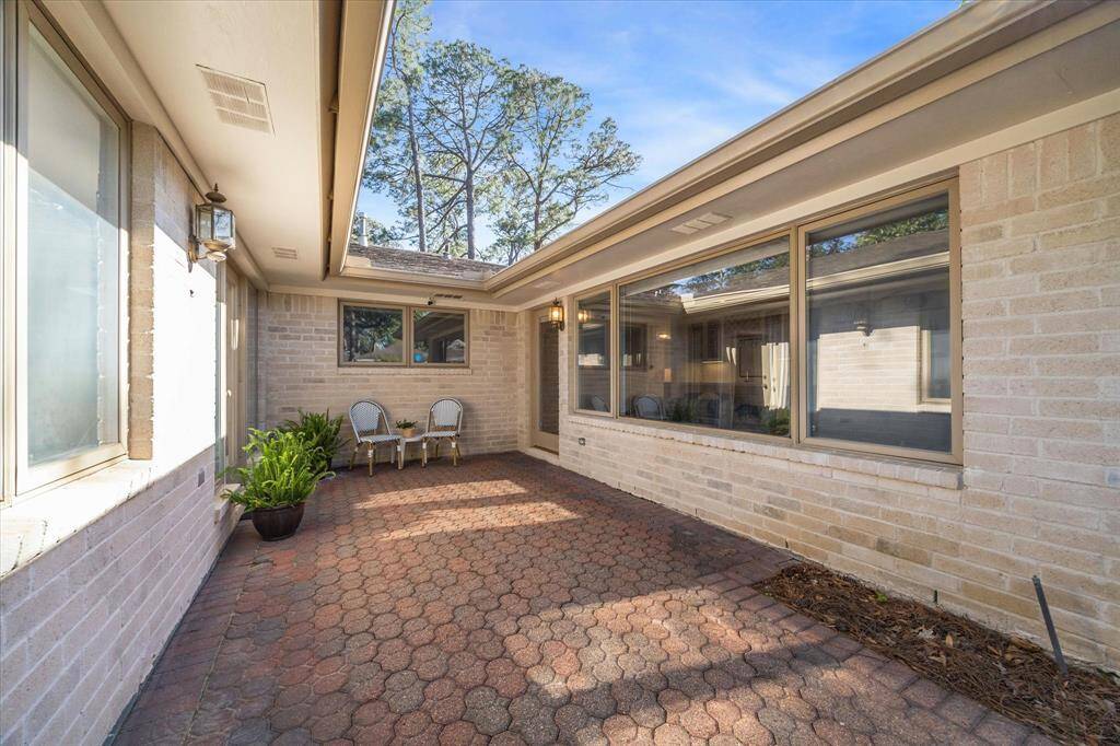 Patio is right off the Primary Suite on the left and the Living Room on the right.