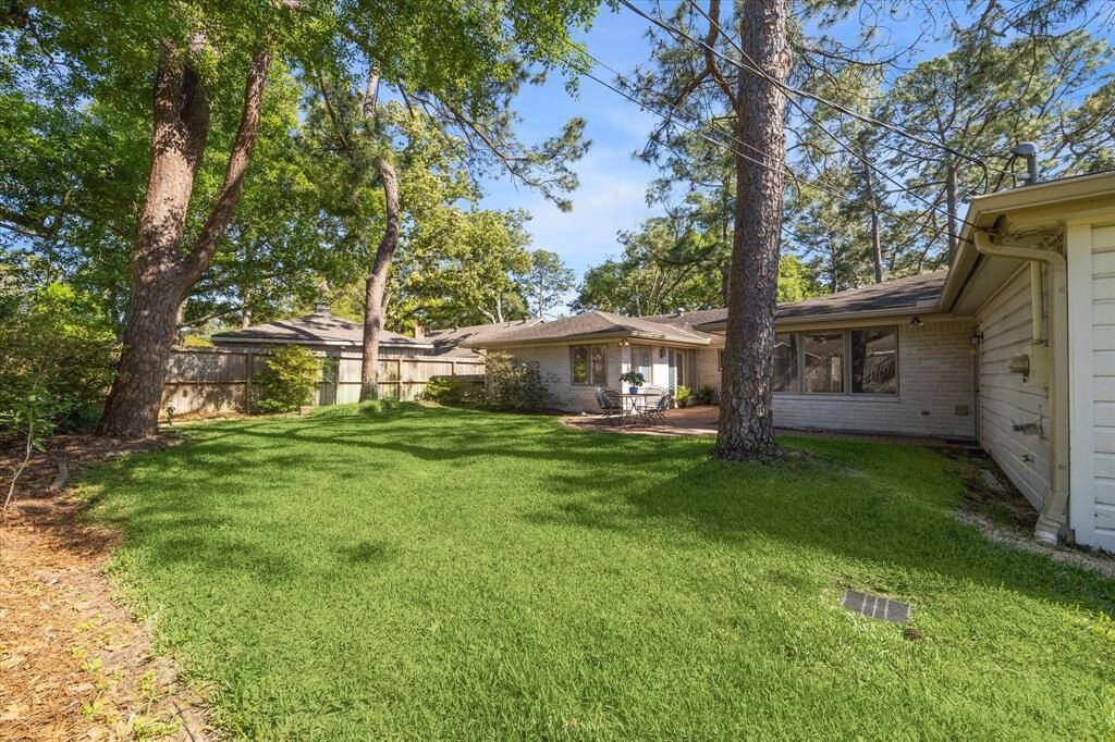 Spacious yard has mature trees.