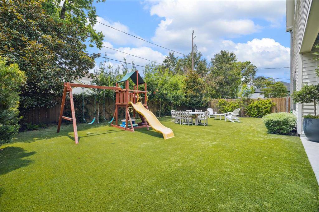This backyard is a pet and play paradise - perfect for running, fetching, and outdoor activities. With ample room for play equipment this backyard is designed for fun and relaxation all year round.