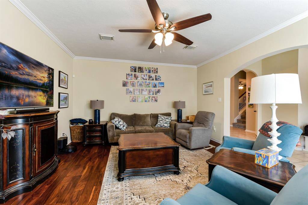 This angle showcases the living room entry that  seamlessly opening into the kitchen, creating an ideal flow for modern living. The bright natural light continues to illuminate both spaces, while the open layout enhances the feeling of openness and connectivity, perfect for both casual meals and entertaining.