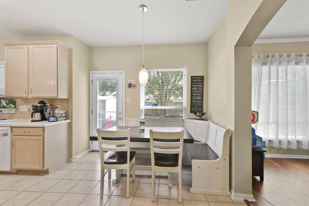 This view captures the breakfast area connecting to the living room