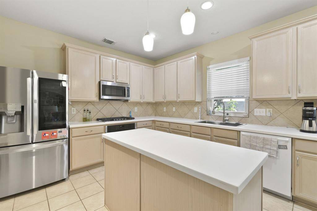 Whether you’re haggling out the perfect recipe or gathering with loved ones, this kitchen is designed for comfort and connection."