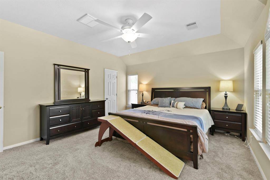 Enjoy the vastness and versatility of this spacious primary bedroom, offering plenty of room to personalize and create your perfect retreat. The open layout allows for a comfortable flow, providing ample space for furniture and decor. With its neutral tones and generous proportions, this room is a true sanctuary, ready to be transformed into a cozy haven of rest and relaxation.
