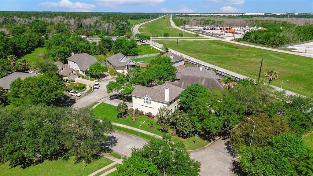 Take in the expansive drone view of this peaceful cul-de-sac, showcasing the well-maintained neighborhood. The circular layout offers a sense of privacy and calm, with homes nestled around a central area. Perfectly located away from busy streets, this serene setting provides both a safe environment and a welcoming community for families and individuals alike.
