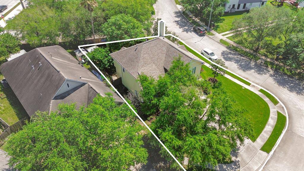 Get a bird’s-eye view of the property with this drone shot, highlighting the boundaries of the spacious lot. The expansive yard offers plenty of room for outdoor activities, with clear demarcation of the lot’s full size. This aerial perspective showcases the potential for customization, landscaping, or future expansion, giving you a sense of the space and opportunity this property provides.