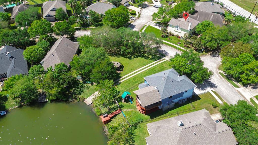 Get a clear view of how close the house is to the neighborhood lake, offering a scenic look at the distance between the property and the serene waters.