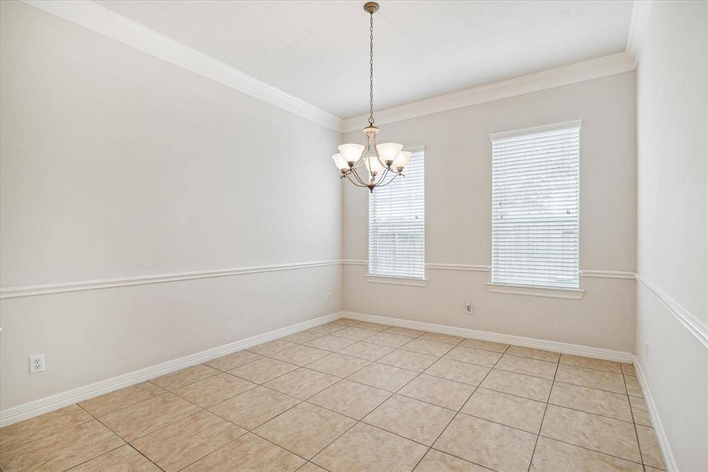 Dining area offers high ceilings with double crown moldings, its expansive area provides an excellent setting for hosting meals and celebrations with family and friends.
