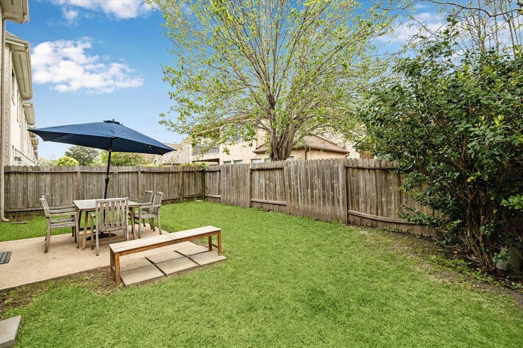 A spectacular view of the vast backyard with shady trees combine to make the backyard the ultimate place to rest and relax!
