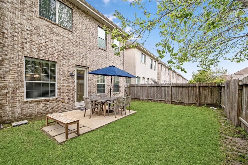 Featuring a spacious patio, the expansive backyard provides the perfect setting for hosting barbecues, outdoor gatherings, and relaxed entertaining with family and friends.