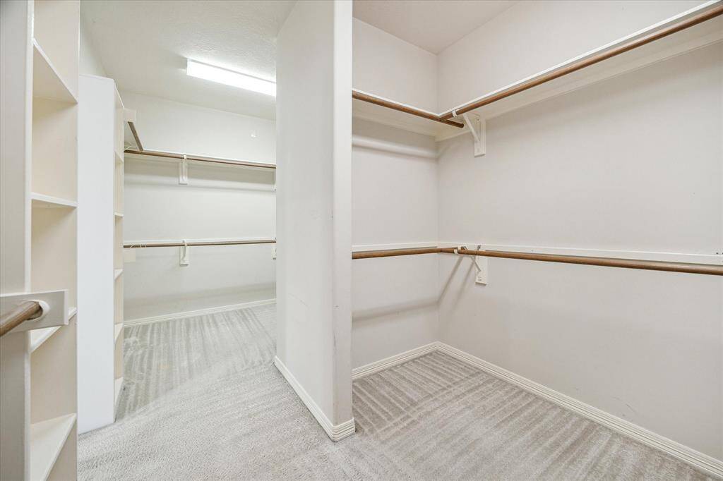 Spacious his-and-hers walk-in closets offer abundant storage and are thoughtfully positioned within the primary suite for easy and convenient access to your wardrobe. Designed for both functionality and comfort—truly a brilliant feature for everyday living.