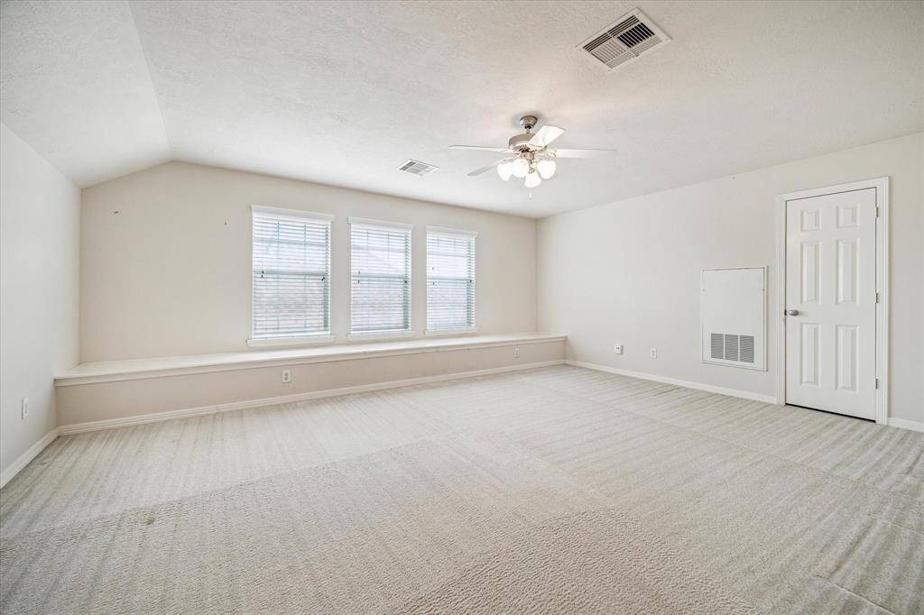 The spacious game room on the third level can easily serve as a fourth bedroom, offering versatility to suit your needs. It features its own walk-in closet and convenient access to it's own bath.