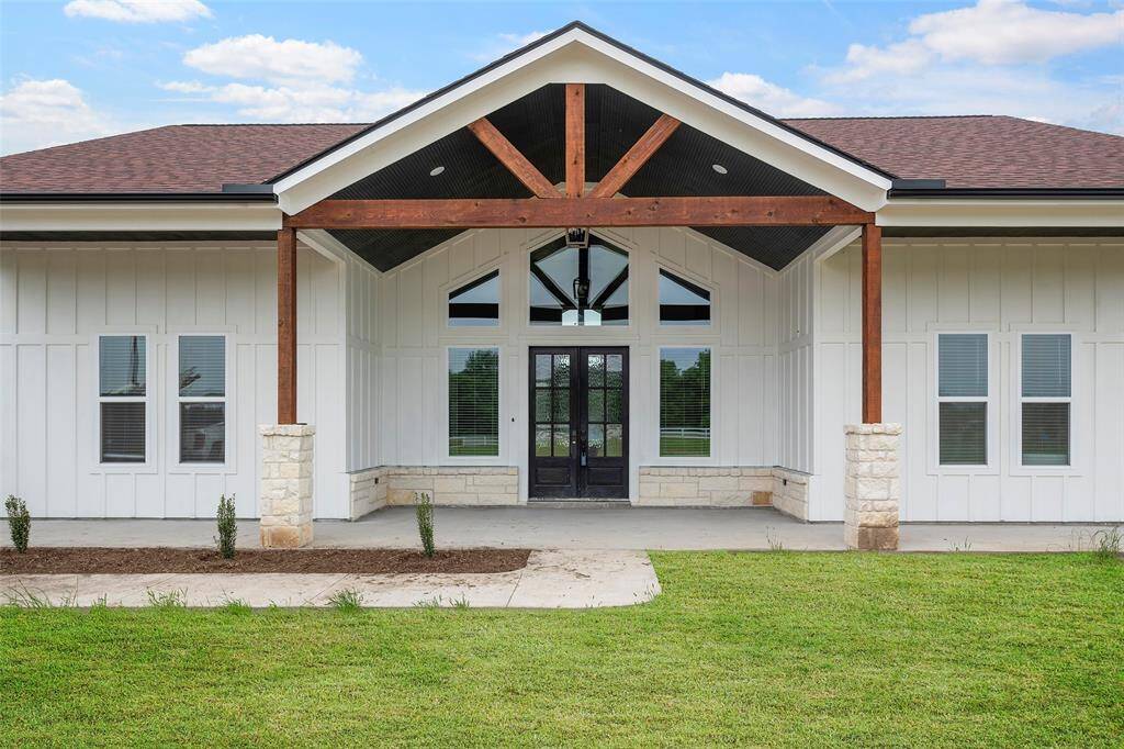 4.83 ACRES!!! Country living at its finest!!! Bring your animals!!! Love this new Farm Style home with 3 Bedrooms and 2.5 Baths with an attached 4 CAR GARAGE. You walk in to see the beautiful floor to ceiling Fireplace and Black Accent Wall with custom mill work with Cathedral ceiling, highlighted with a wooden beam, and modern ceiling fan with views of the well equipped Kitchen with Pot Filler, Farm Sink, Black Quartz Waterfall Island, and Walk-in Pantry.