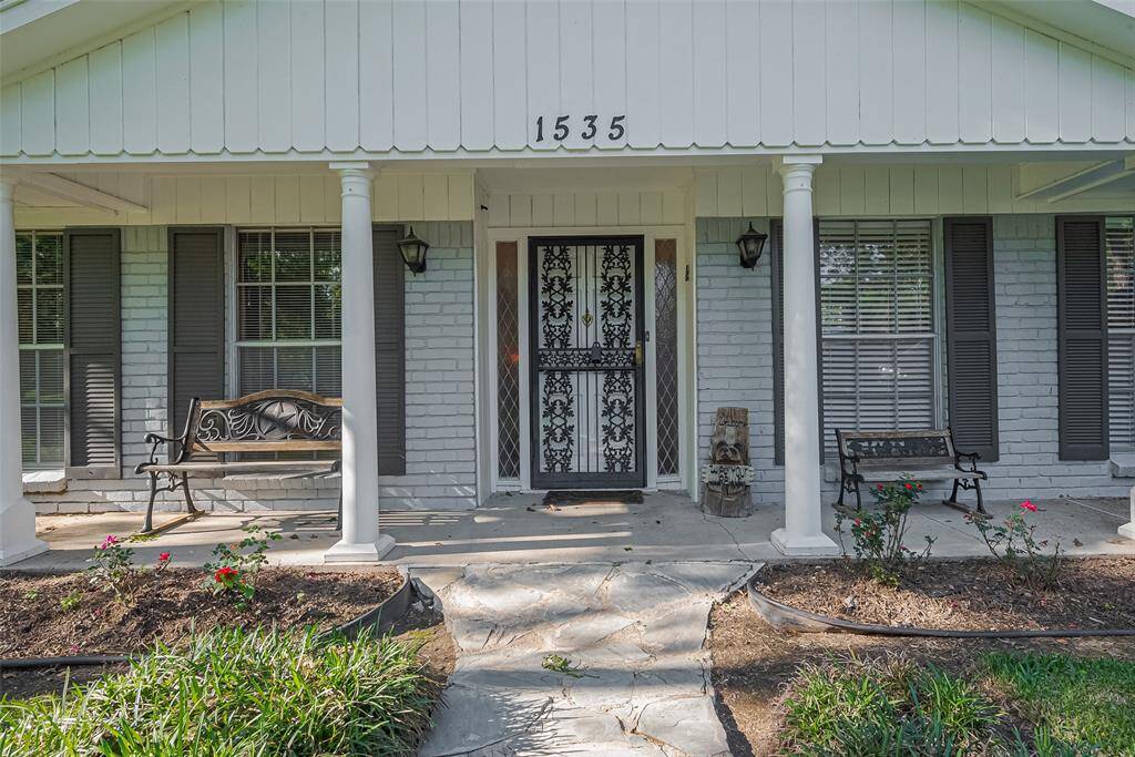 Enjoy your morning coffee on this tranquil front porch.