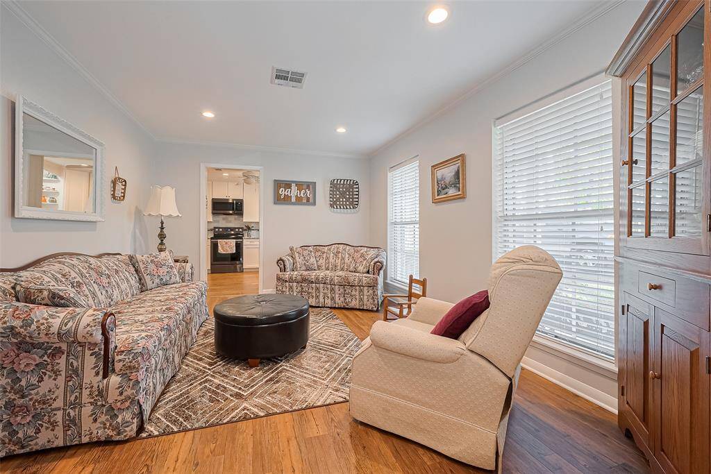 Formal living area at the front of the home is seamlessly connected to the kitchen for easy entertaining.  It could also be used for formal dining.