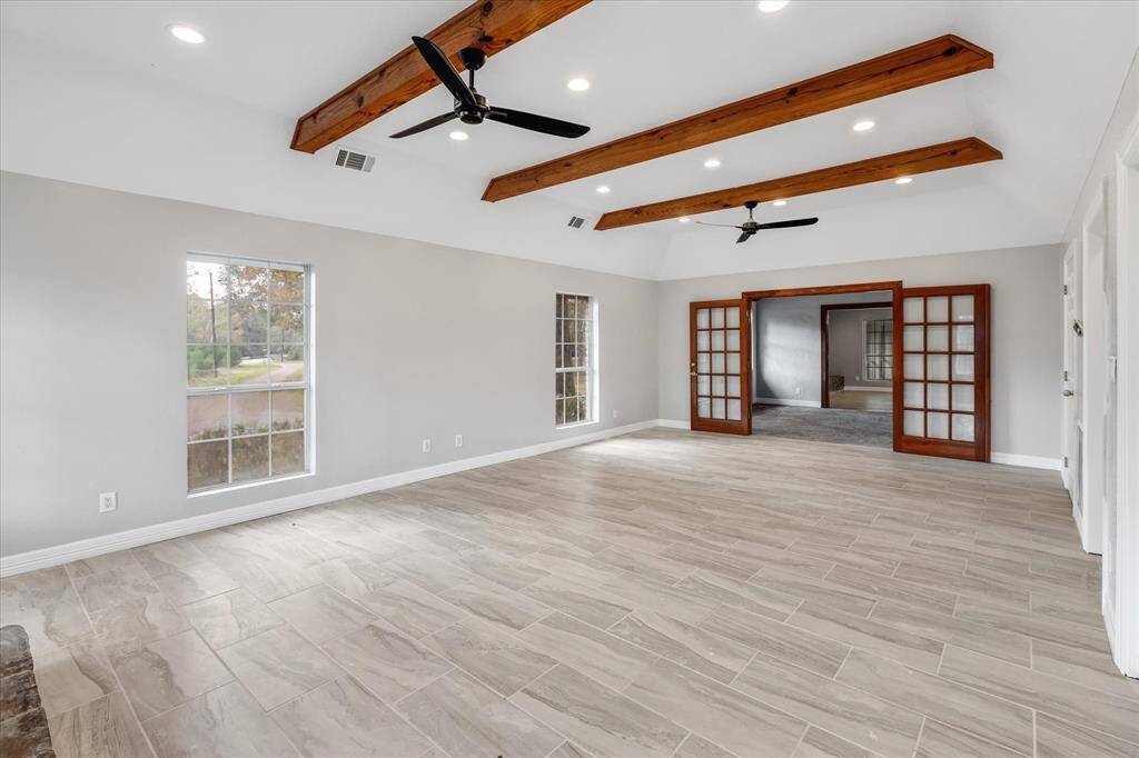 Capturing the view of the spacious Primary Suite from the fireplace.