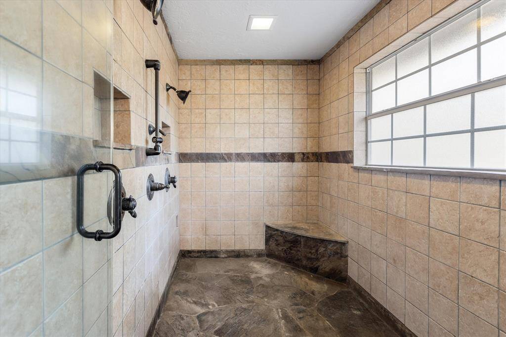 First floor Primary Suite spacious walk-in shower.