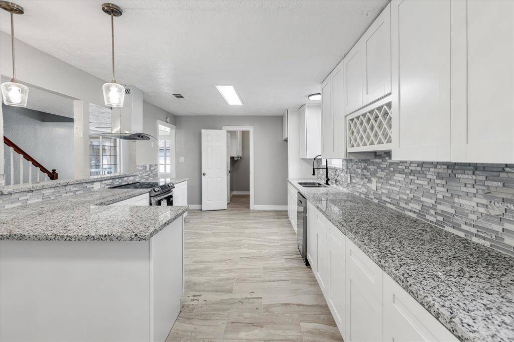 Sleek, polished kitchen with ample counter space.