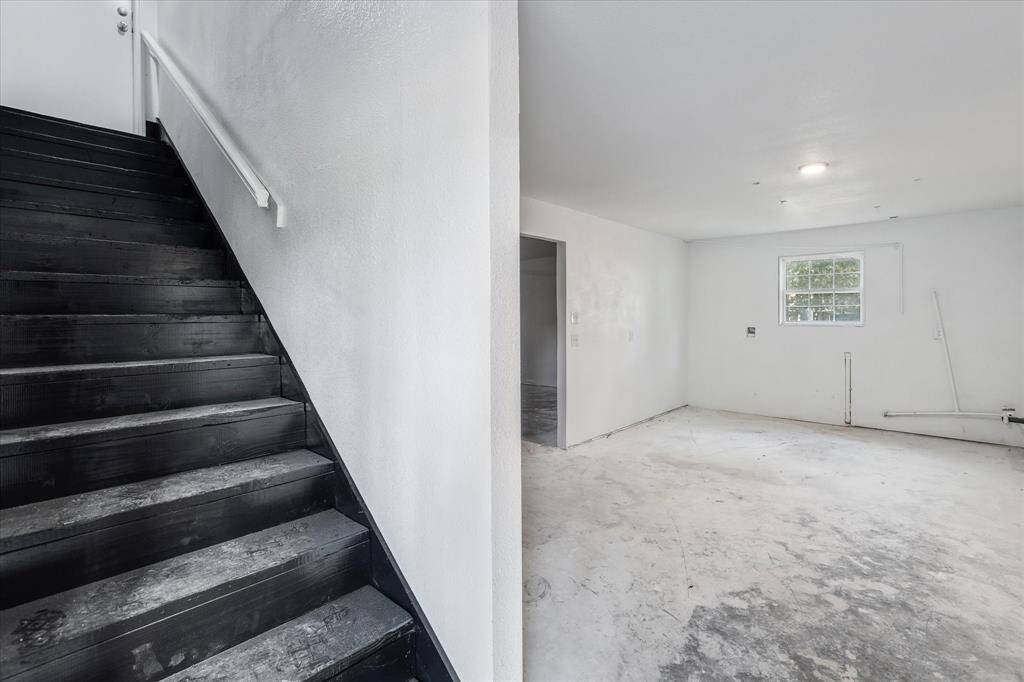 The well-designed garage space accommodates two vehicles comfortably.