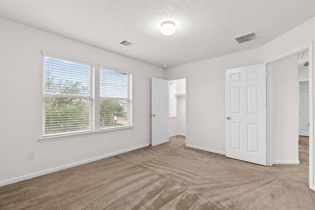 Natural lighting with neutral walls and carpet, It's versatile and ready for personalization.
