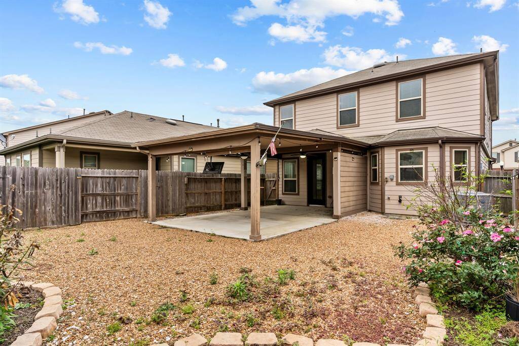 This backyard boosts a spectacular size covered patio and and a lovely and landscaped flower beds for that green thumb
