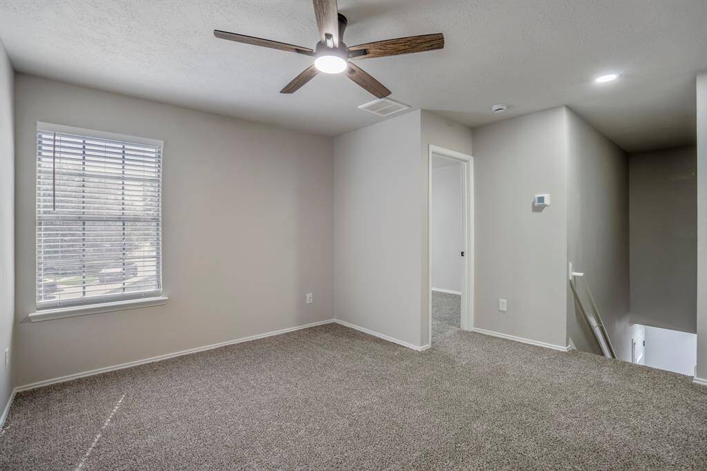 Centrally located at the top of the stairs, the game room offers a versatile space for entertaining, relaxing, or creating a dedicated play or media zone.