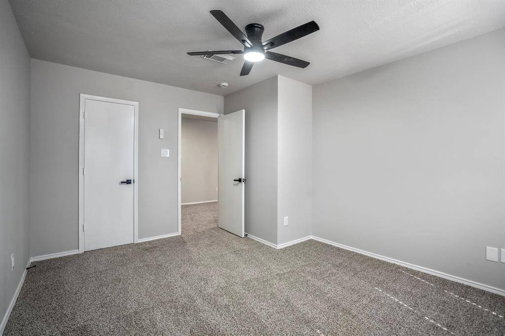 Bedroom number 1 has new carpet, fresh paint, new ceiling fan and offers a nice walk-in closet.