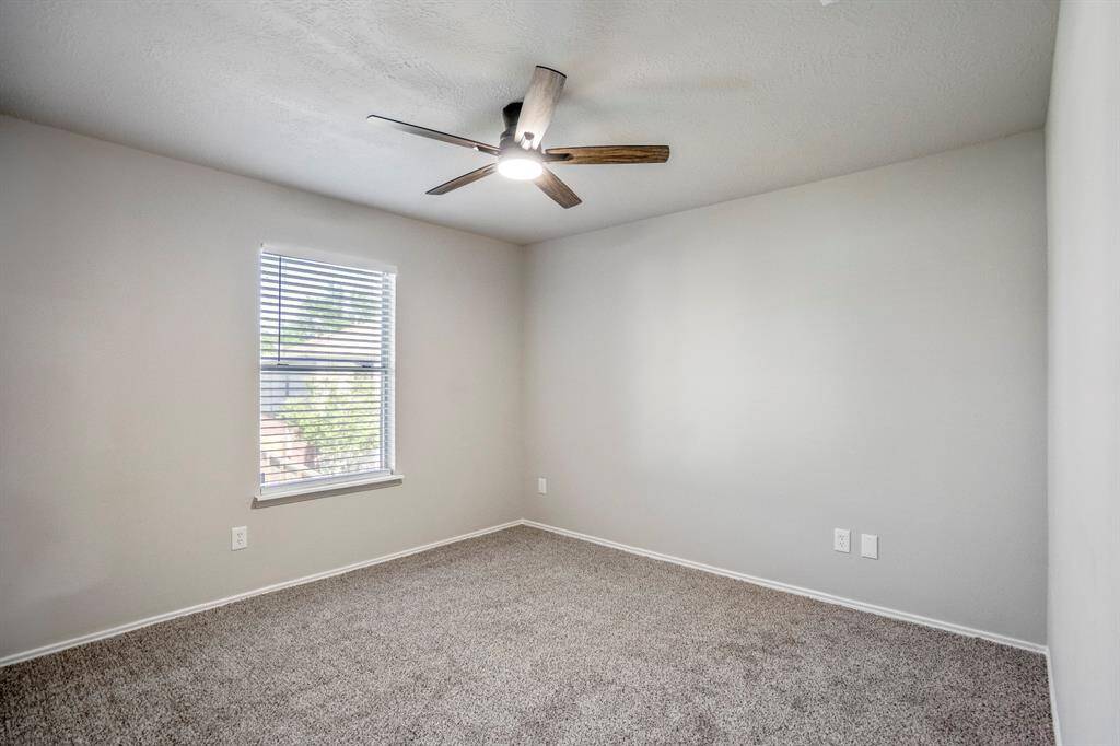 The third bedroom has new flooring, fresh paint, new fan and a walk-in closet.