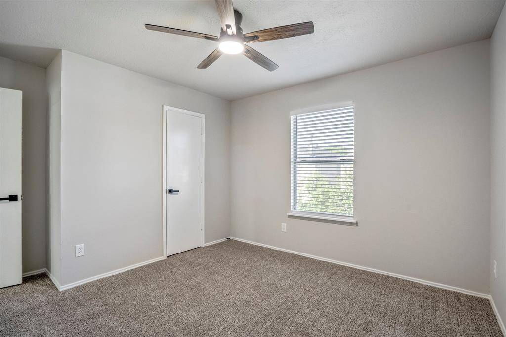 The third bedroom has new flooring, fresh paint, new fan and a walk-in closet.