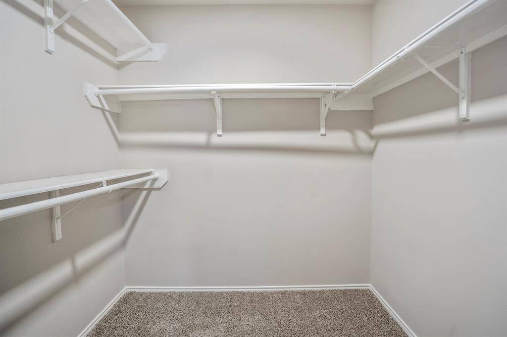 Primary walk-in closet.