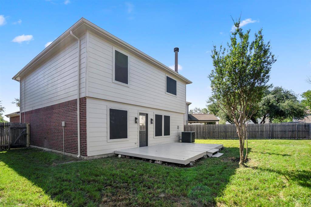 Step out back and enjoy a spacious yard with room to roam and a wood deck that's perfect for grilling, relaxing, or hosting friends and family.