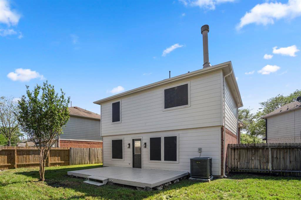 Step out back and enjoy a spacious yard with room to roam and a wood deck that's perfect for grilling, relaxing, or hosting friends and family.