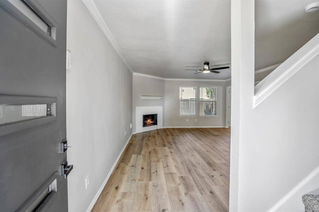 Step inside to a beautifully remodeled interior featuring fresh paint and brand-new flooring throughout — a clean, modern canvas ready for your personal touch!