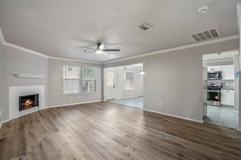Step inside to a beautifully remodeled interior featuring fresh paint and brand-new flooring throughout — a clean, modern canvas ready for your personal touch!