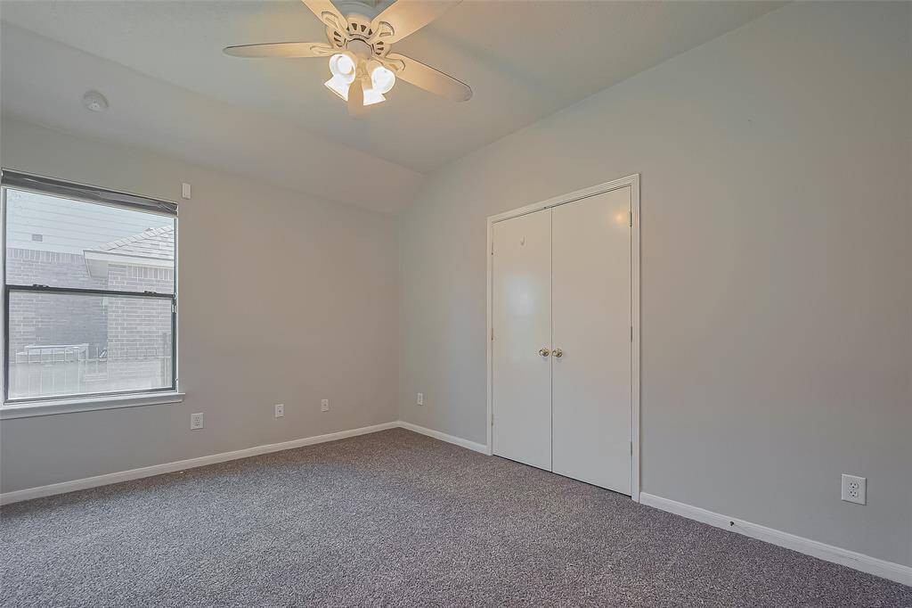 One of 3 bedrooms.  New paint and carpet and a good size closet with double doors.