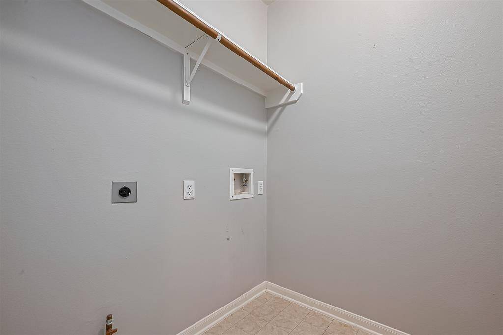 Laundry room located off the garage entry