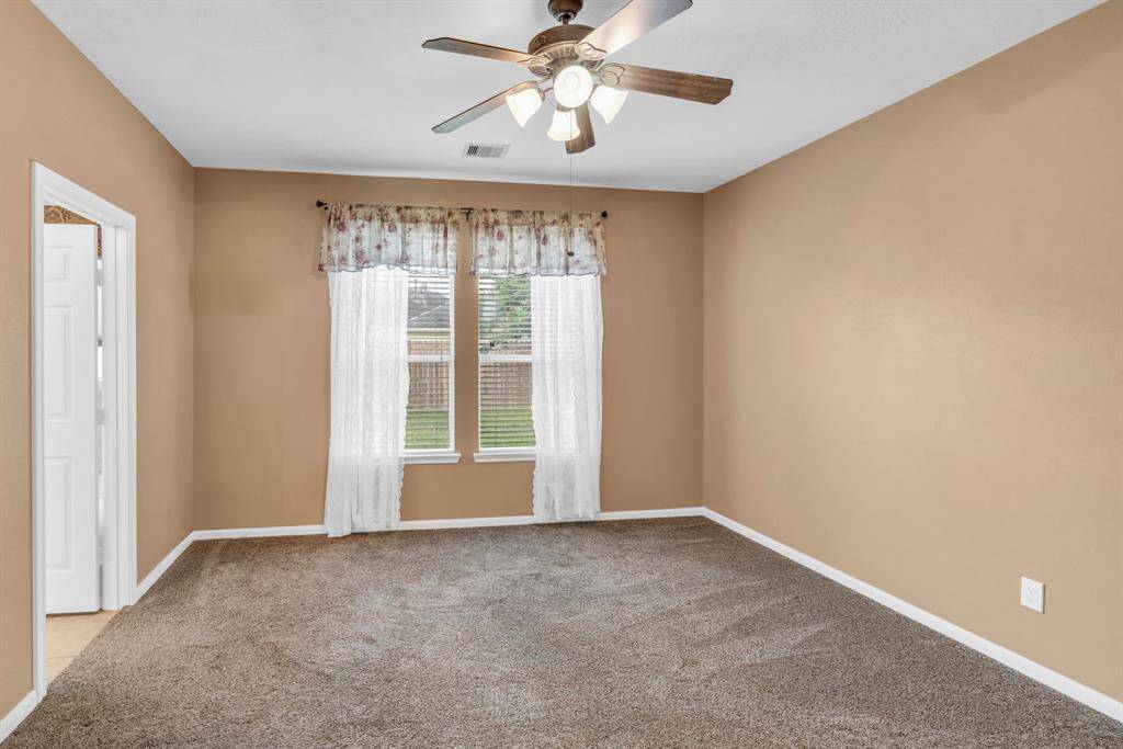 Primary Bedroom overlooking the backyard! 16727 Tranquility Park Dr., Cypress, TX  77429