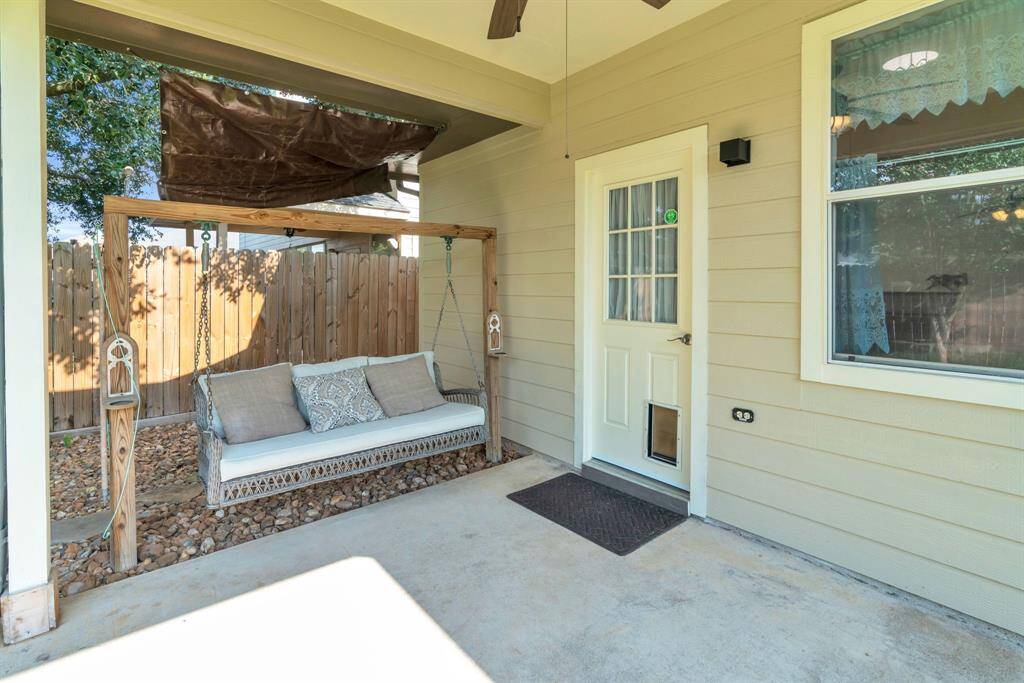 Outdoor Patio with an outdoor swing & Ceiling Fan! 16727 Tranquility Park Dr., Cypress, TX  77429