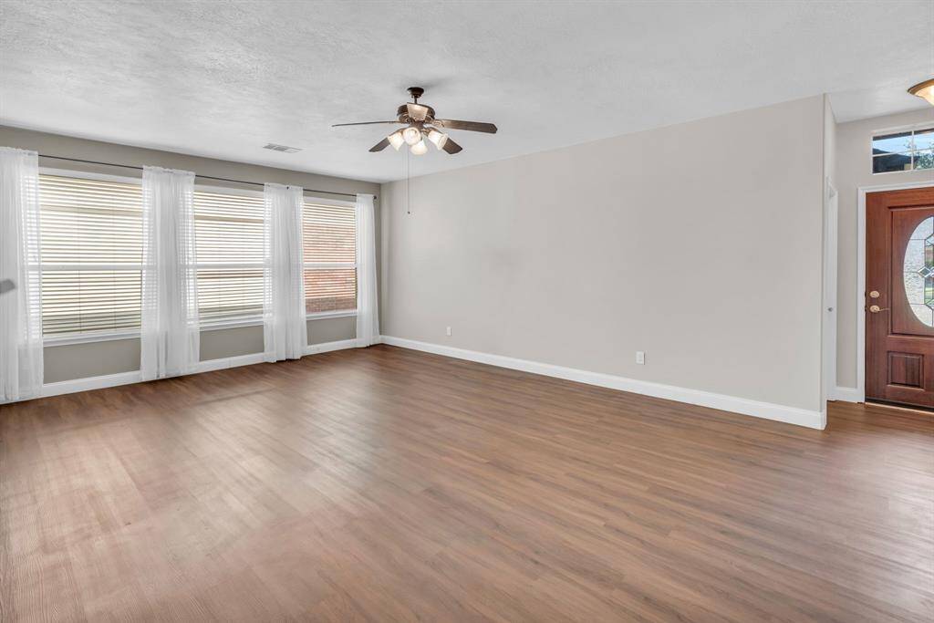 This wall of windows allows in lots of natural lighting! 16727 Tranquility Park Dr., Cypress, TX  77429