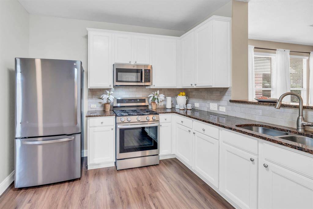 Kitchen with lots of cabinets & countertop space - Stainless Steel Appliances! 16727 Tranquility Park Dr., Cypress, TX  77429